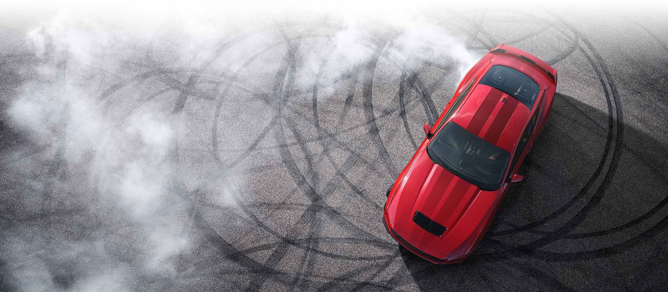Overhead view of a 2024 Ford Mustang® model with tire tracks on pavement | Matthews-Currie Ford in Nokomis FL